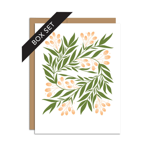 Box set of 8 folded A2 greeting cards with envelopes with an illustration of tuscan florals such as green leaves and orange details.
