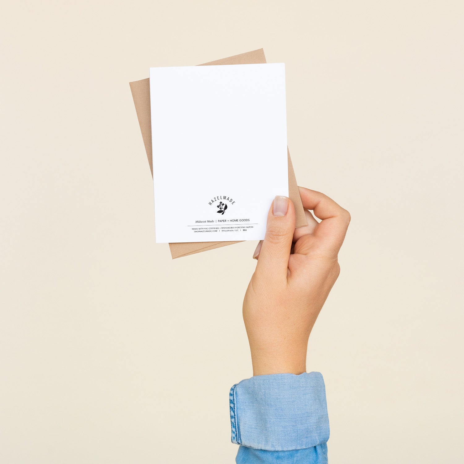 Back of the Happy Birthday Cupcake greeting card and envelope held in hand