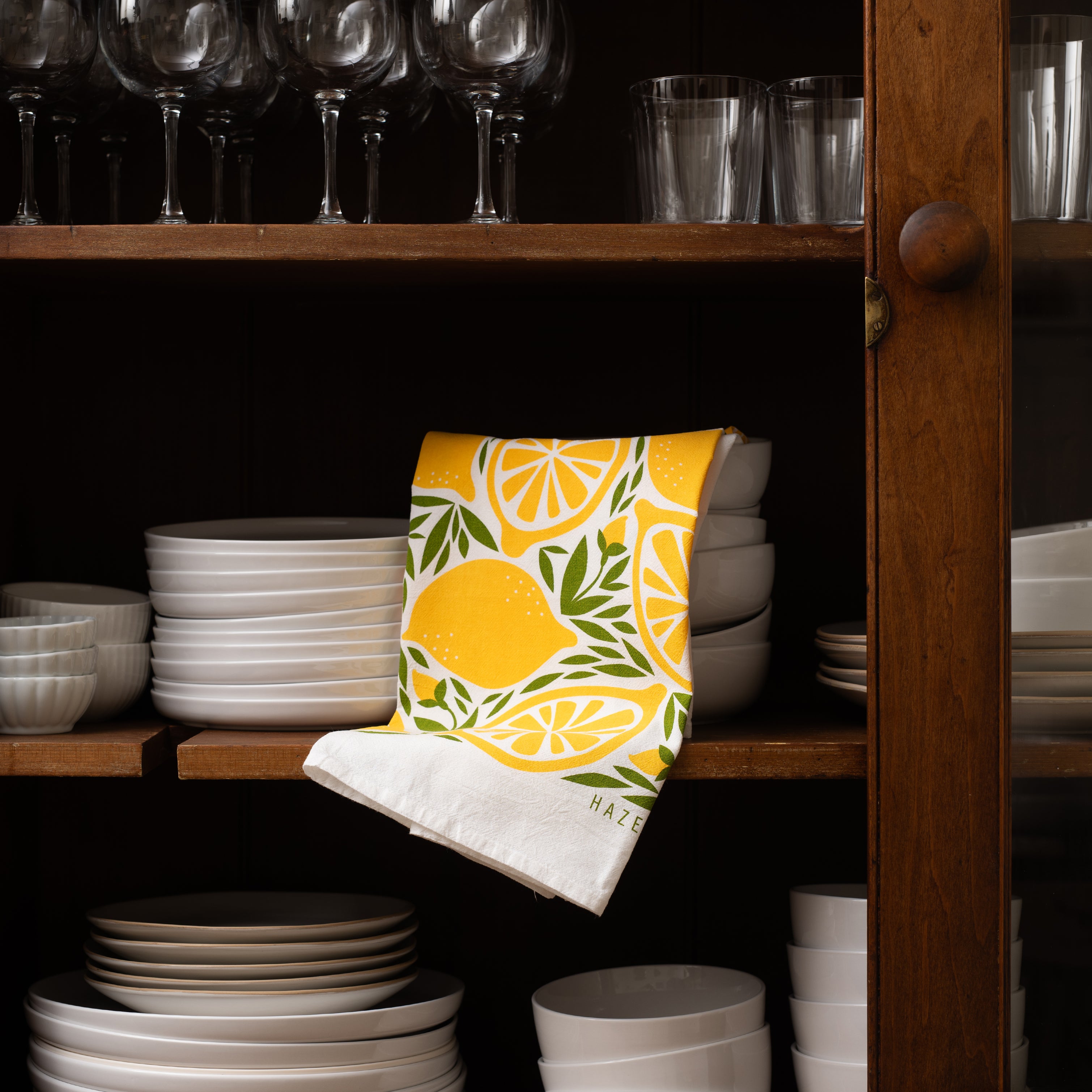 Lemon Tea Towel styled on open kitchen shelving