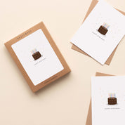 Boxed set of Happy Birthday Chocolate Cake Greeting Cards with two cards and envelopes featuring a hand-illustrated chocolate cake with candles design