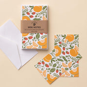 Farmstand Fruits Mini Note Cards set with white envelope and wrap band shown on a neutral background