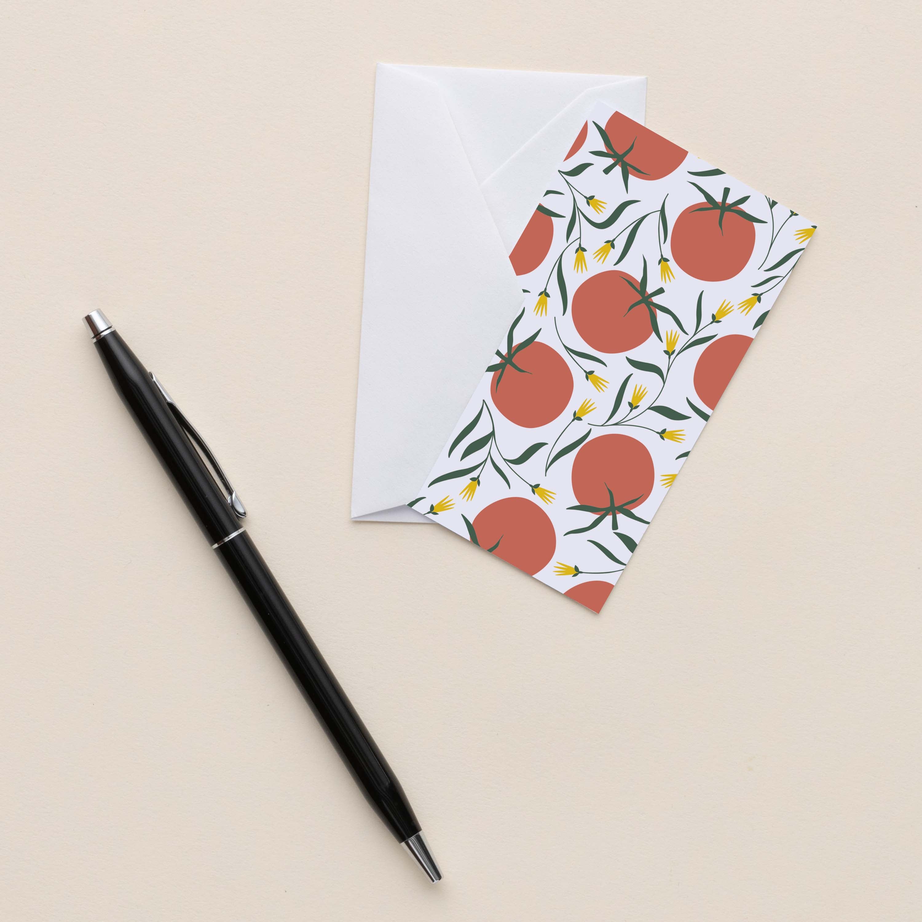Tomatoes Mini Note Card with white envelope beside a black pen on a neutral background