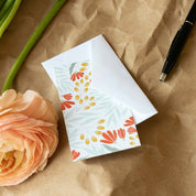 Paris Fields Mini Note Card styled with a white envelope and orange flower on kraft paper