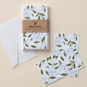 Dogwood Flowers Mini Note Cards set with white envelope and wrap band shown on a neutral background