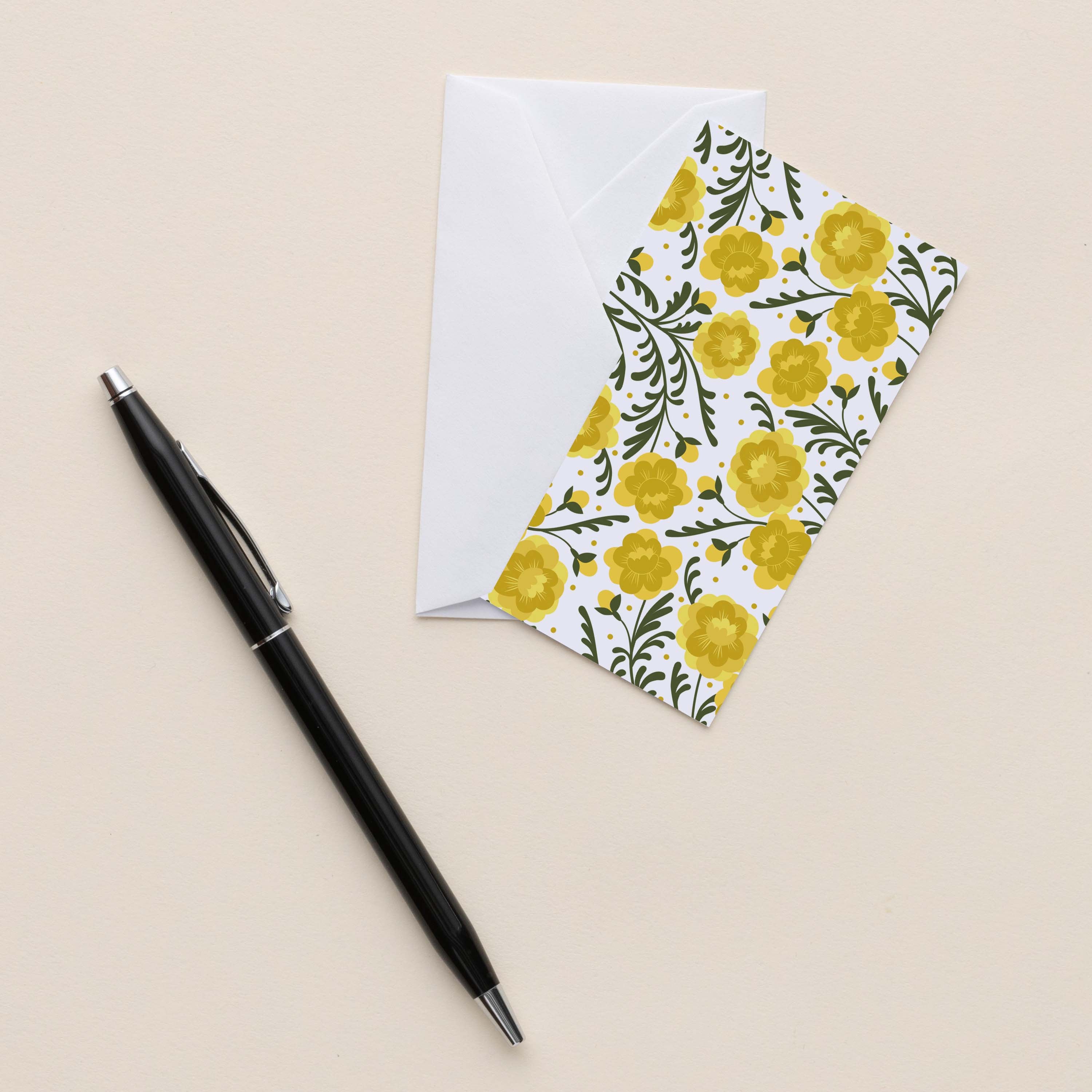 Marigold Mini Note Card with white envelope beside a black pen on a neutral background