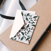 Winterberry Mini Note Card styled with a white envelope and a pen on a kraft gift box