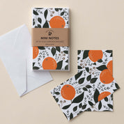 Winter Citrus Mini Note Cards set with white envelope and wrap band shown on a neutral background