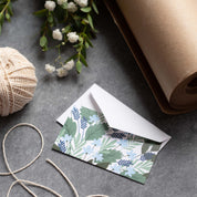 Blue Bouquet Mini Note Card styled with twine and wrapping paper on a gray surface
