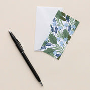 Blue Bouquet Mini Note Card with white envelope beside a black pen on a neutral background
