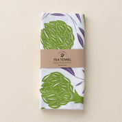 Folded Artichokes + Olives Tea Towel with wrap band and hand-illustrated artichoke and olive design