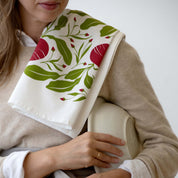 Beets Tea Towel draped over a person’s shoulder
