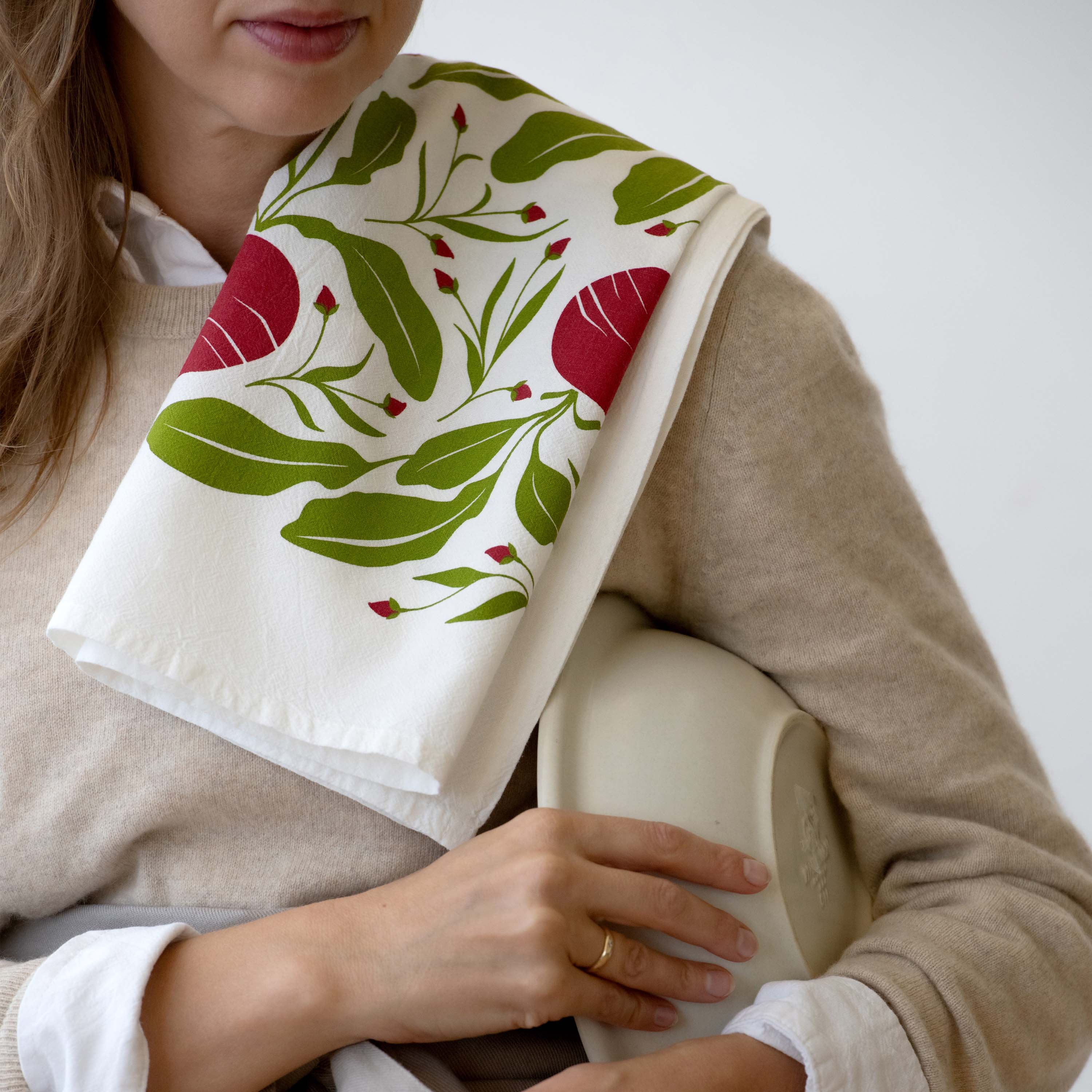 Beets Tea Towel draped over a person’s shoulder