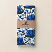 Folded Blue Gentian Tea Towel with wrap band and hand-illustrated blue floral design