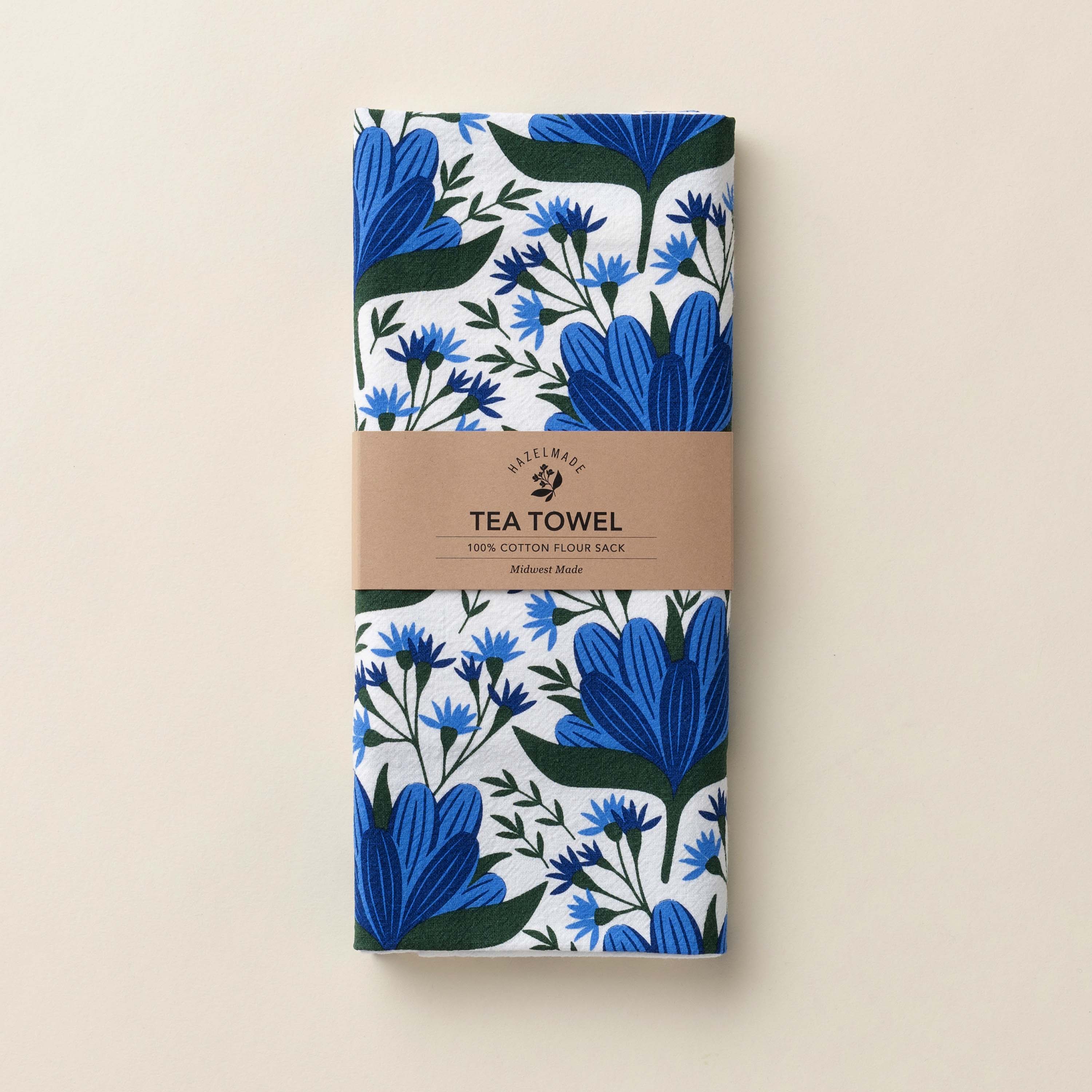 Folded Blue Gentian Tea Towel with wrap band and hand-illustrated blue floral design