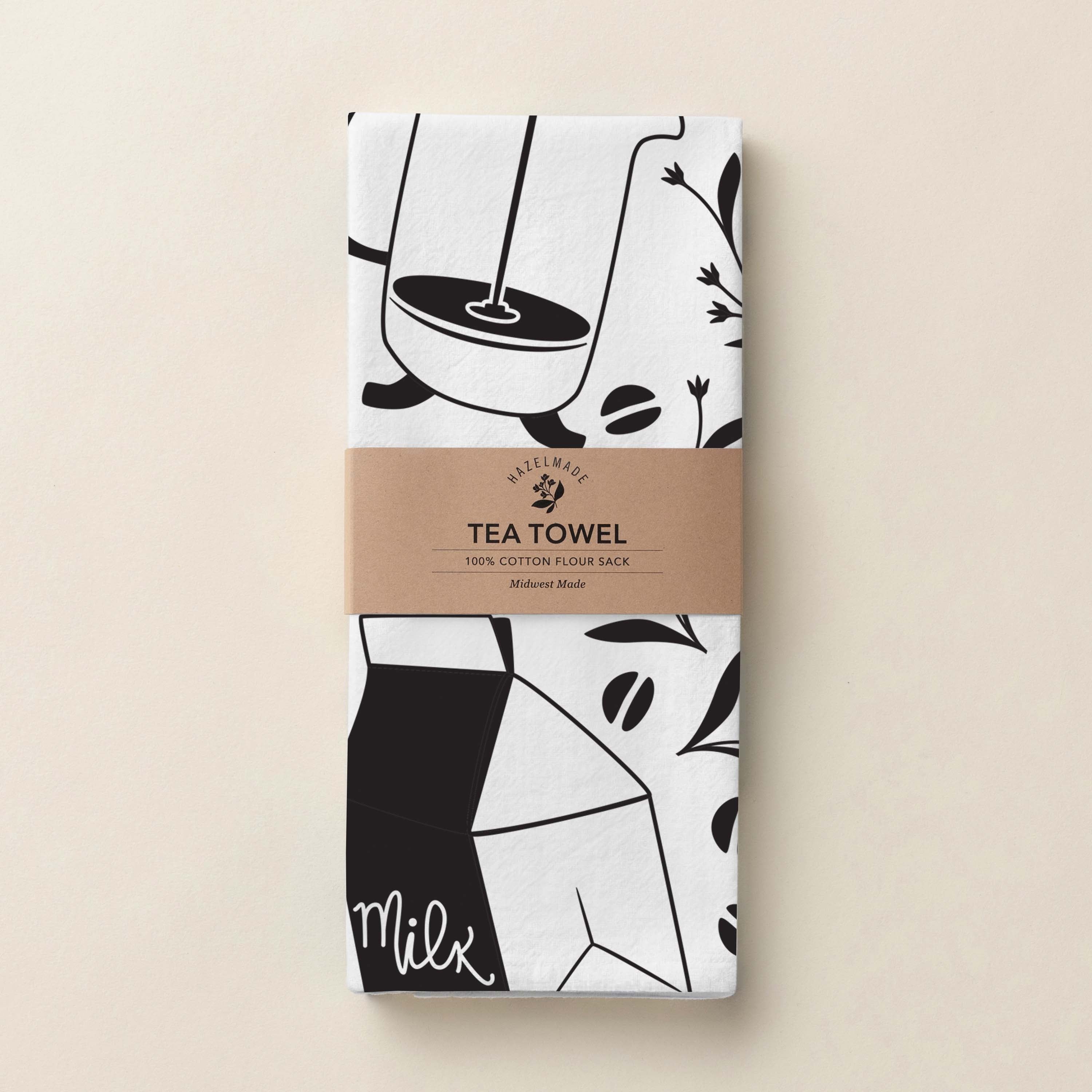 Folded Coffee + Milk Tea Towel with wrap band and hand-illustrated coffee and milk pattern