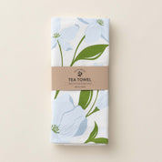 Folded Dogwood Tea Towel with wrap band and hand-illustrated dogwood flower design