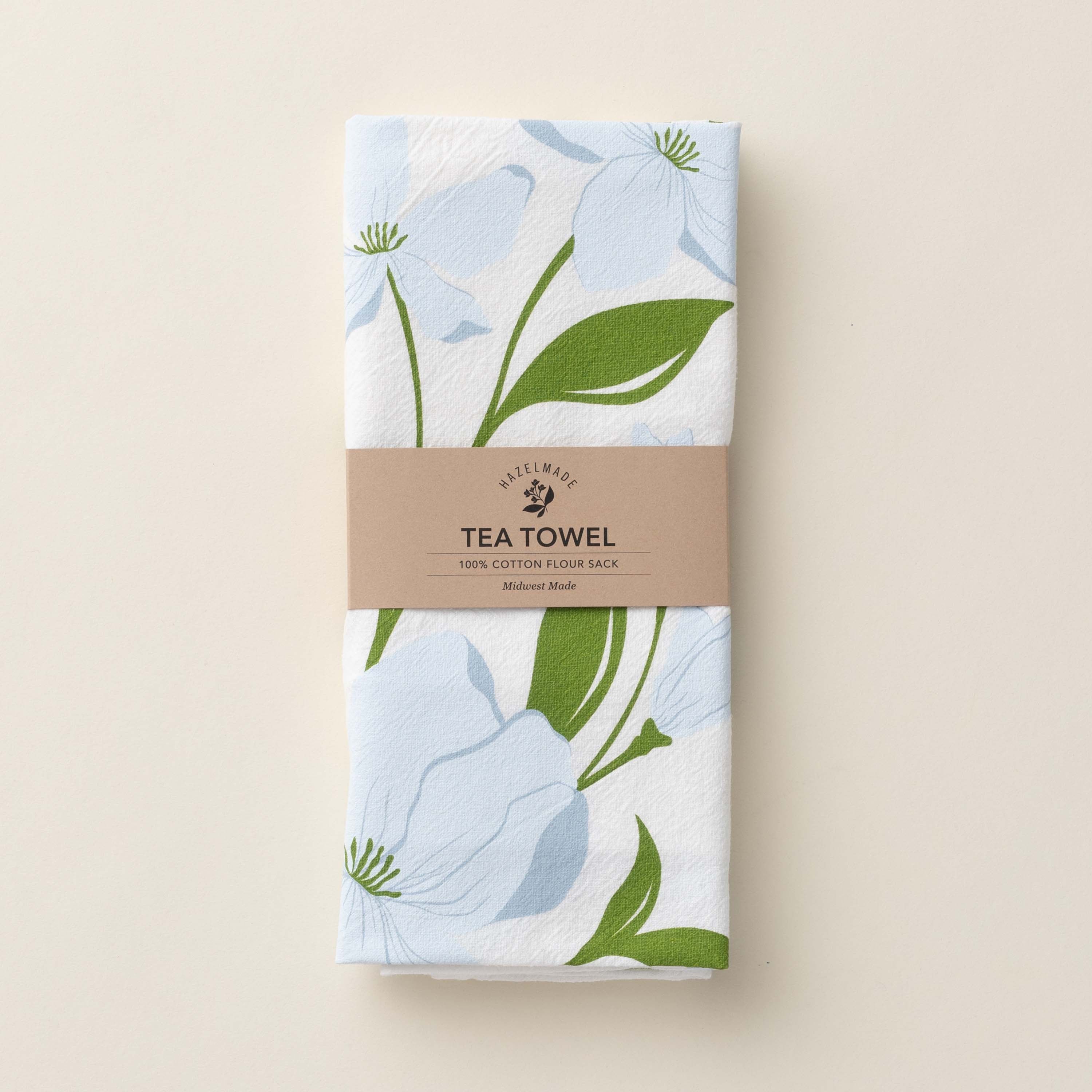 Folded Dogwood Tea Towel with wrap band and hand-illustrated dogwood flower design