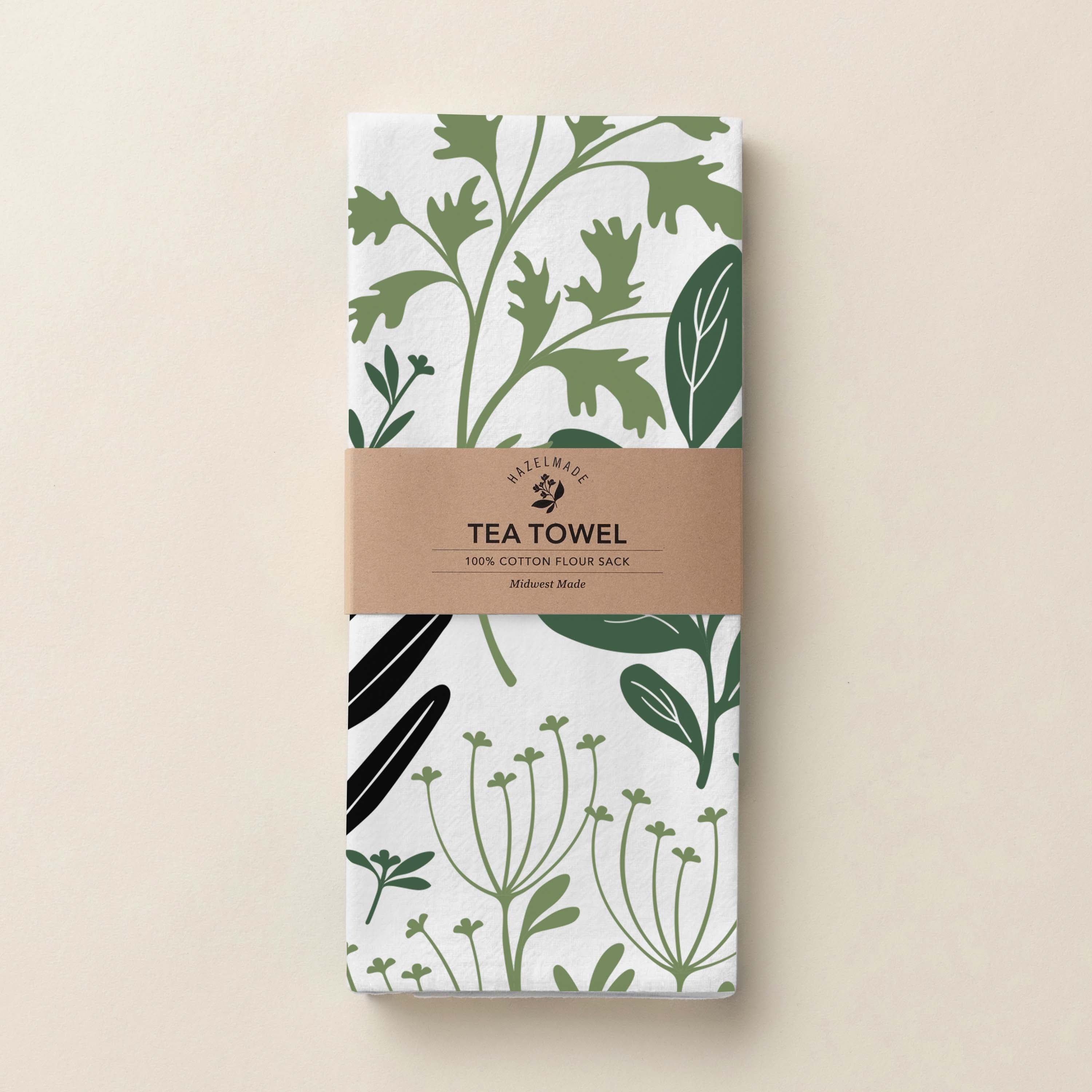 Folded Fresh Herbs Tea Towel with wrap band and hand-illustrated herb pattern