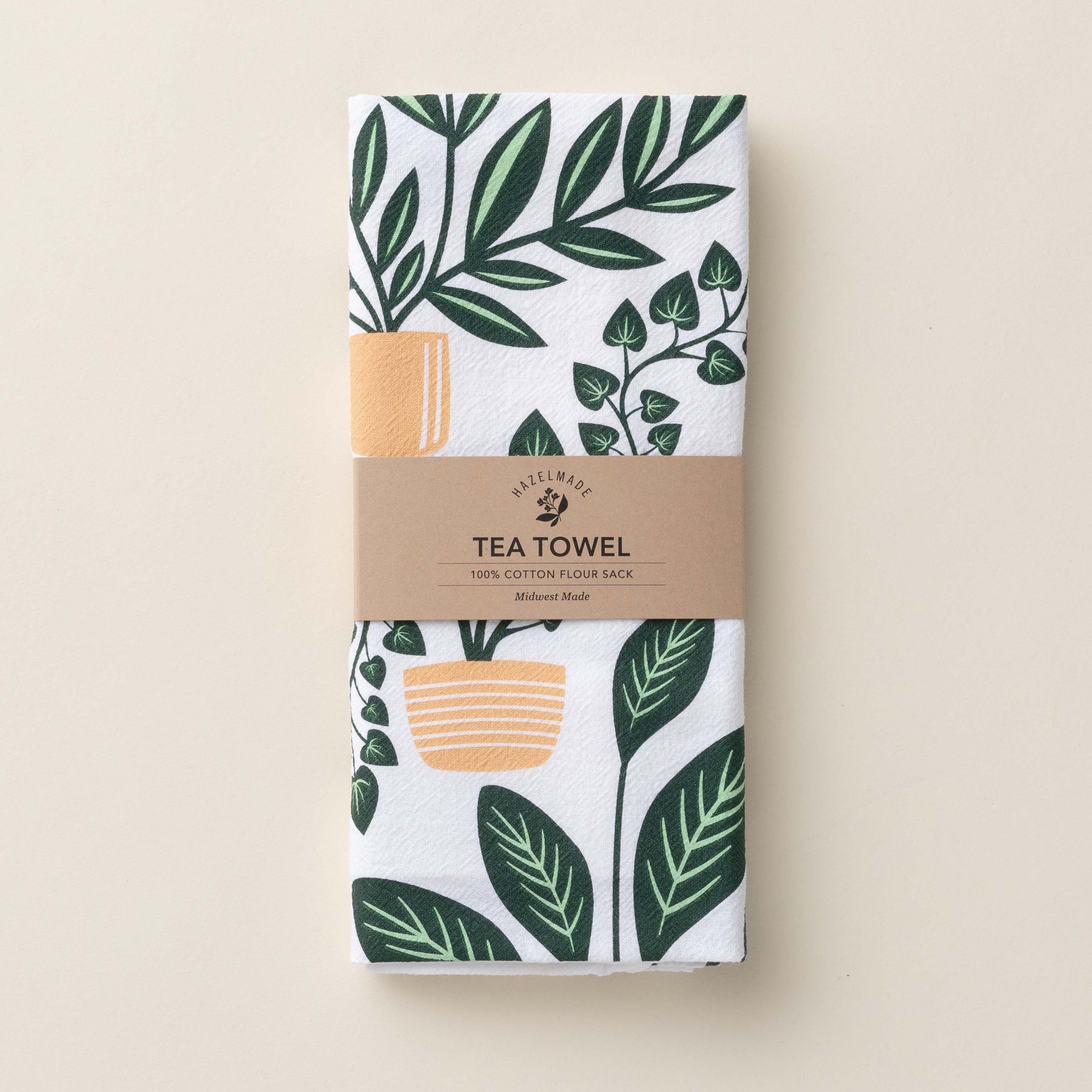 Folded House Plants Tea Towel with wrap band and hand-illustrated house plant design