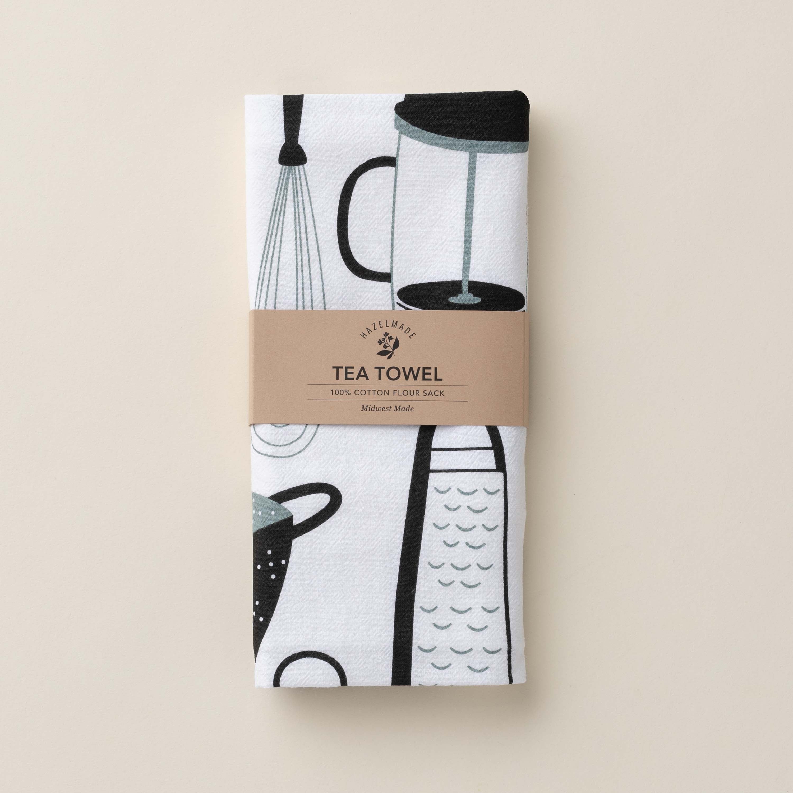 Folded Kitchen Utensils Tea Towel with wrap band and hand-illustrated kitchen utensil design
