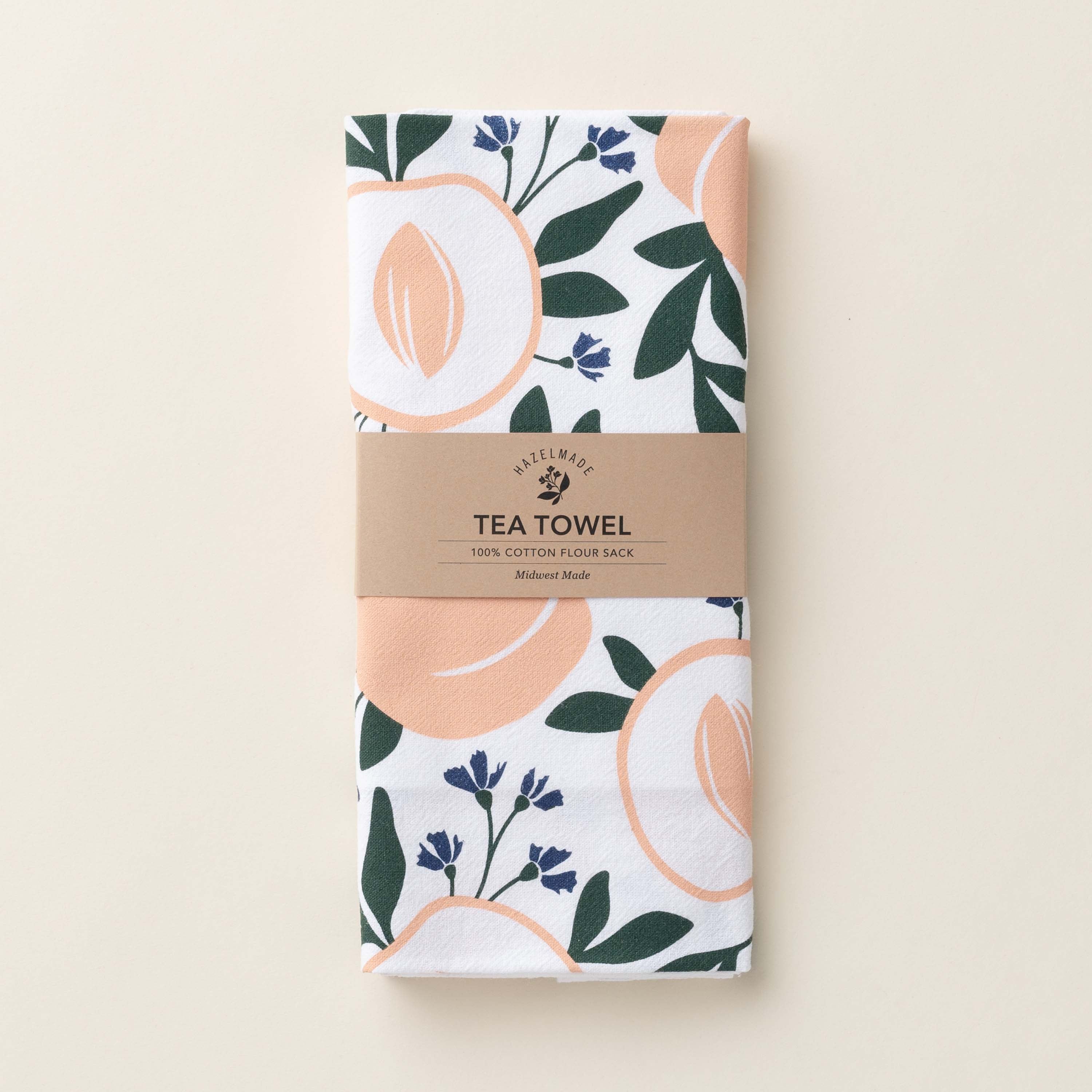 Folded Peaches Tea Towel with wrap band and hand-illustrated peach design
