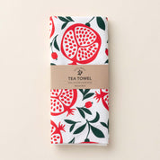 Folded Pomegranates Tea Towel with wrap band and hand-illustrated pomegranate design