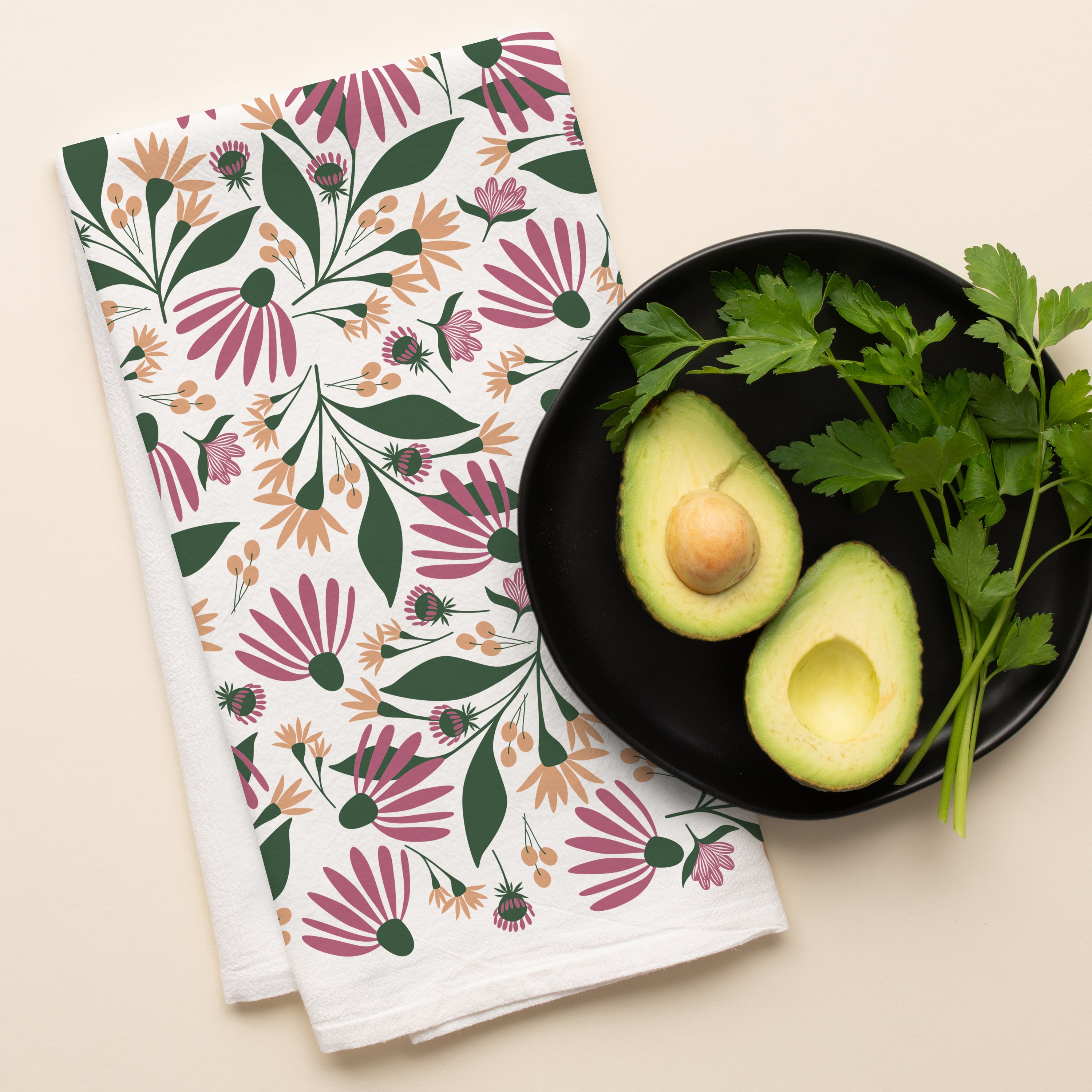 Spring Florals Tea Towel with hand-illustrated floral pattern beside a black bowl of avocados and fresh herbs
