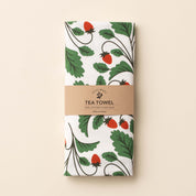Folded Wild Strawberries Tea Towel with wrap band and hand-illustrated wild strawberry design