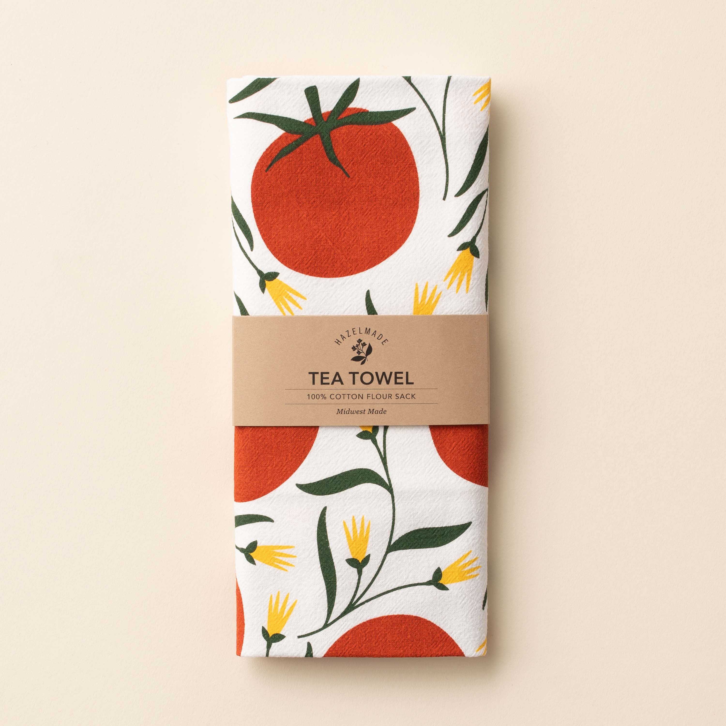 Folded Tomatoes Tea Towel with wrap band and hand-illustrated tomato design