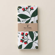 Folded Winterberry Tea Towel with wrap band and hand-illustrated winterberry design