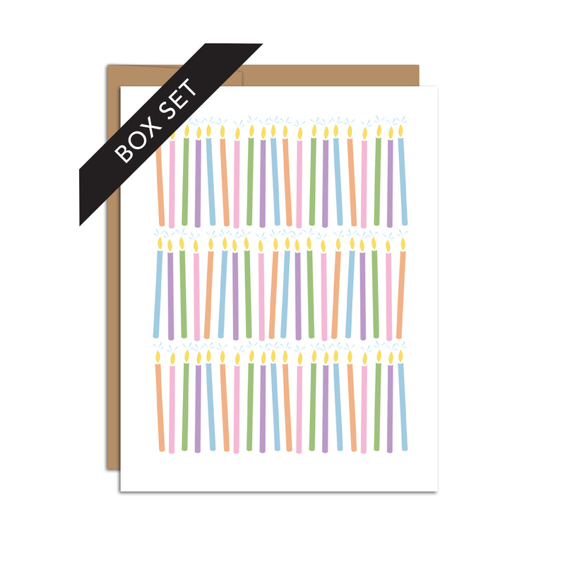 Box set of 8 folded A2 greeting cards with envelopes with an illustration of three rows of orange, pink, green, purple, and blue repeating candles.