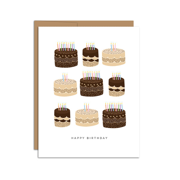 Single folded A2 greeting card with an envelope with an illustration of a grid of various brown and tan birthday cakes with colorful candles. Below the grid, the text states "Happy Birthday".