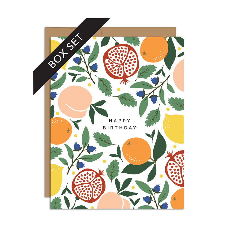 Box set of 8 folded A2 greeting cards with envelopes with an illustration of peaches, oranges, pomegranates, blueberries, and lemons. The middle of the card states "Happy Birthday".