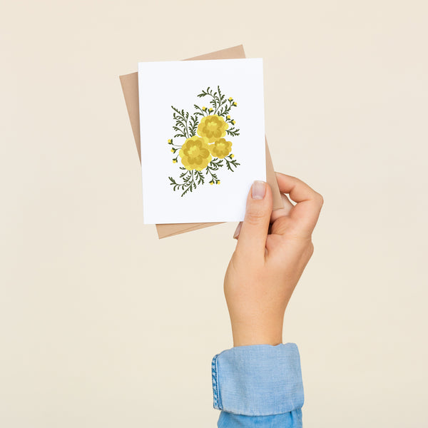 Box set of 8 folded A2 greeting cards with envelopes with an illustration of yellow marigolds in the center of the card.