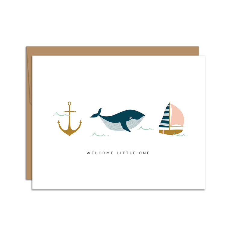 Single folded A2 greeting card with an envelope with an illustration of an anchor, whale, and boat with text below all three stating "Welcome Little One".