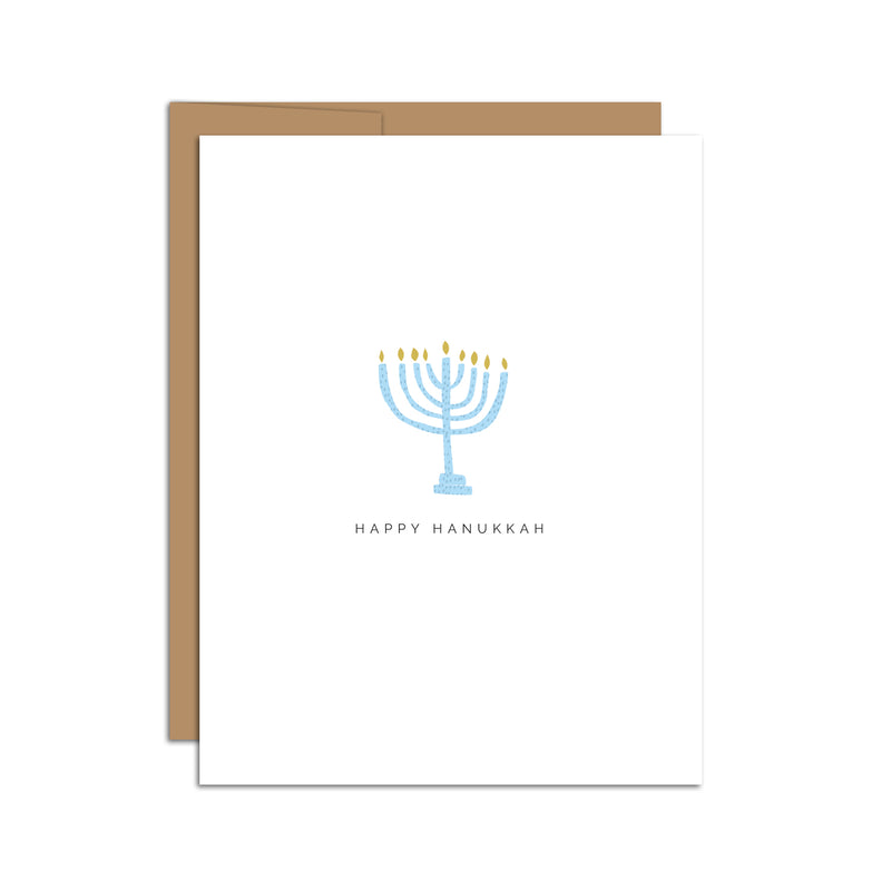 Single folded A2 greeting card with an envelope with an illustration of a blue menorah with yellow flames. Below it is text that states "Happy Hanukkah".