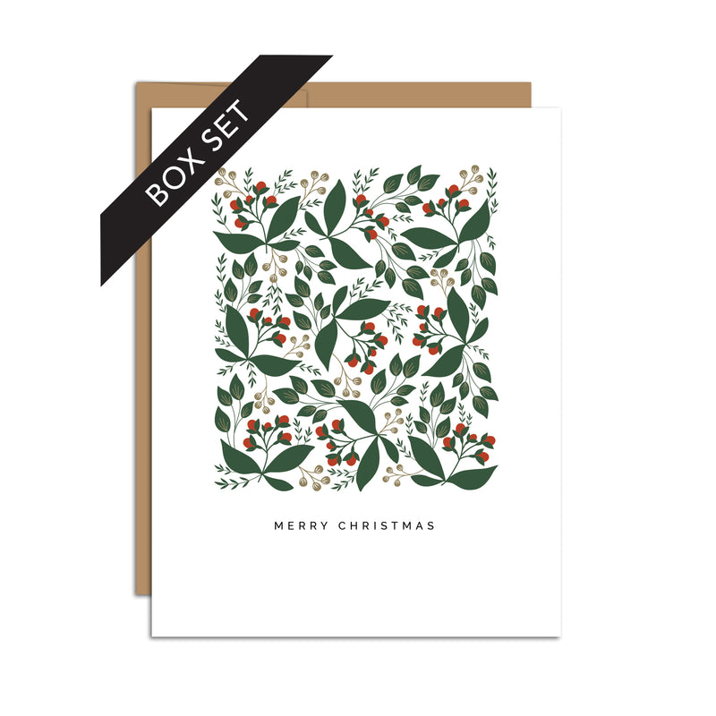 Box set of 8 folded A2 greeting cards with envelopes with an illustration  of green leaves and red berries. Below this pattern is text that states "Merry Christmas".