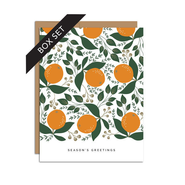 Box set of 8 folded A2 greeting cards with envelopes with an illustration  of oranges and green leaves in a repeating pattern. Below is text that states "Season's Greetings".