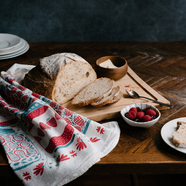 A single 100% cotton flour sack towel with an illustration of jam jars