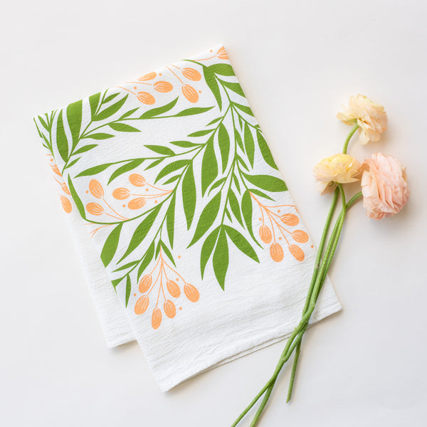 A single 100% cotton flour sack towel with an illustration of tuscan florals