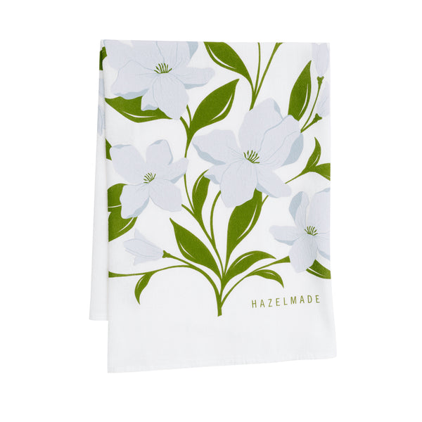 A single 100% cotton flour sack towel with an illustration of a bouquet of blue flowers