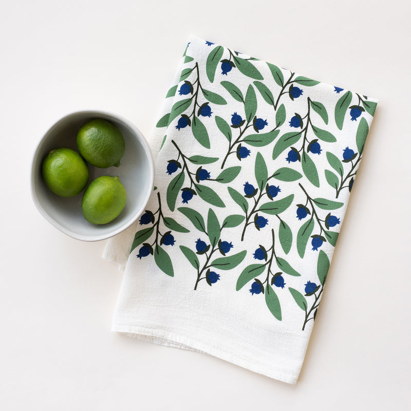 A single 100% cotton flour sack towel with an illustration of blueberries