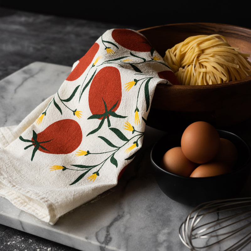 A single 100% cotton flour sack towel with an illustration of tomatoes
