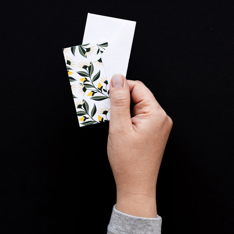 Set of 10 flat mini note cards with envelopes and an illustrated pattern of yellow aster flowers and green leaves.