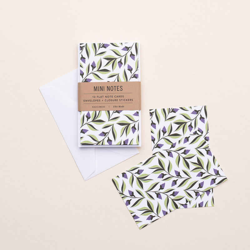 Set of 10 flat mini note cards with envelopes and an illustrated pattern of purple ivy flowers and green leaves.