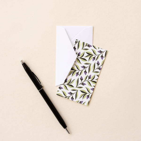 Set of 10 flat mini note cards with envelopes and an illustrated pattern of purple ivy flowers and green leaves.