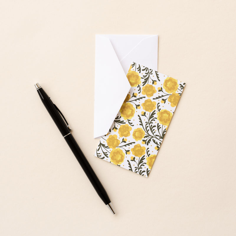 Set of 10 flat mini note cards with envelopes and an illustrated pattern of yellow marigold flowers and dark green vine-like leaves.