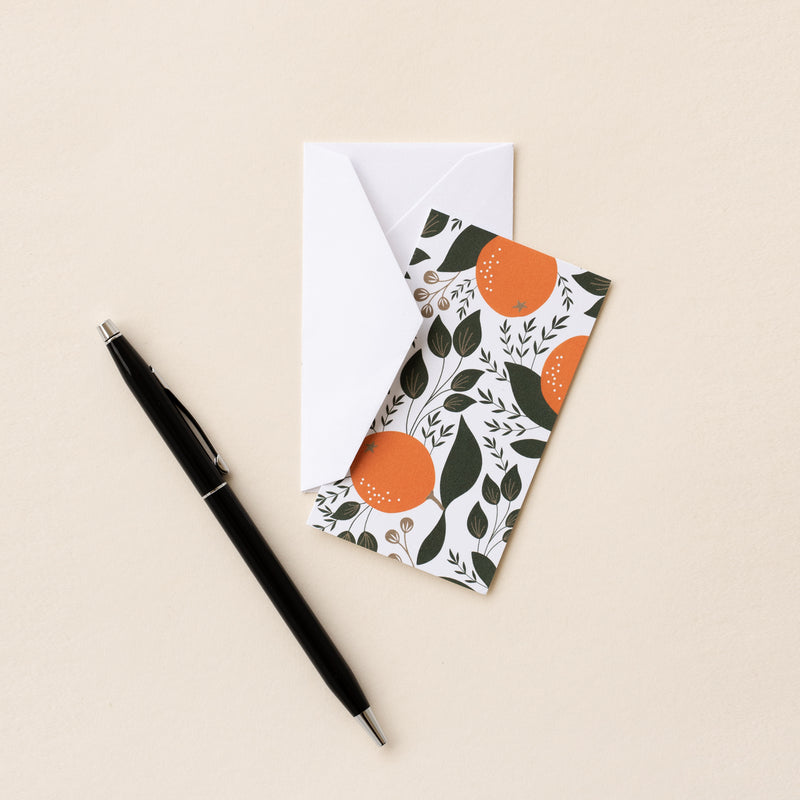 Set of 10 flat mini note cards with envelopes and an illustrated pattern of winter citrus oranges and green leaves.