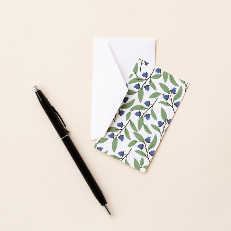 Set of 10 flat mini note cards with envelopes and an illustrated pattern of dark blue blueberries and green leaves.