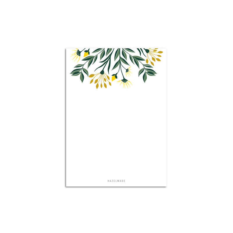A single 4” by 5.5” small notepad with 50 tear-off sheets and an illustration of yellow flowers and green leaves sprouting from the top of the notepad while the rest is blank.